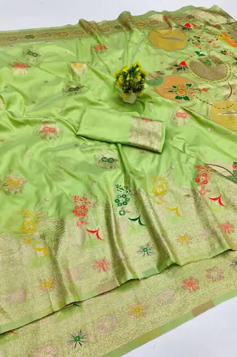 Light green zari woven banarasi silk blend saree with blouse piece
