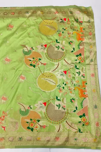 Light green zari woven silk blend saree with blouse piece