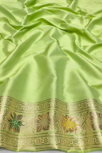 Light green zari woven silk blend saree with blouse piece