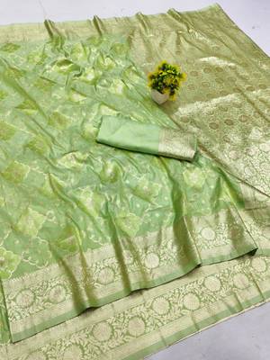 Green zari woven silk blend saree with blouse piece 1