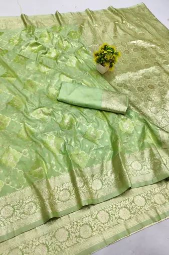 Green zari woven silk blend saree with blouse piece