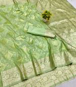 Green zari woven banarasi silk blend saree with blouse piece