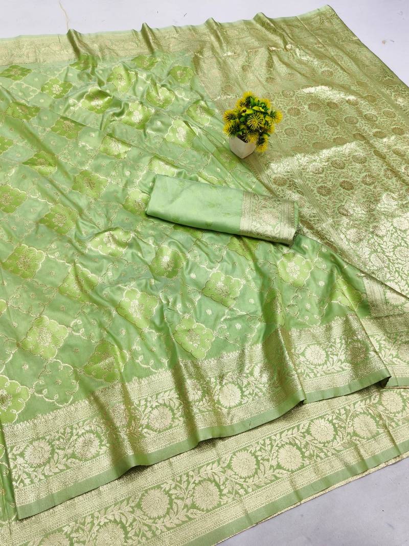 Green zari woven banarasi silk blend saree with blouse piece
