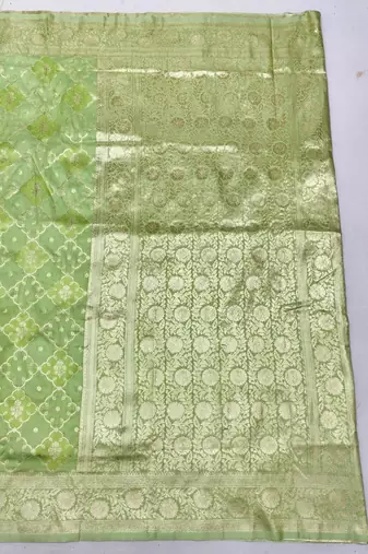 Green zari woven silk blend saree with blouse piece