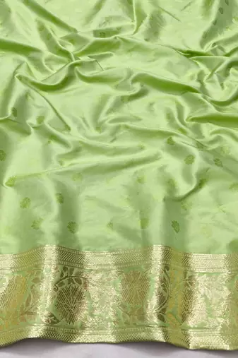 Green zari woven silk blend saree with blouse piece