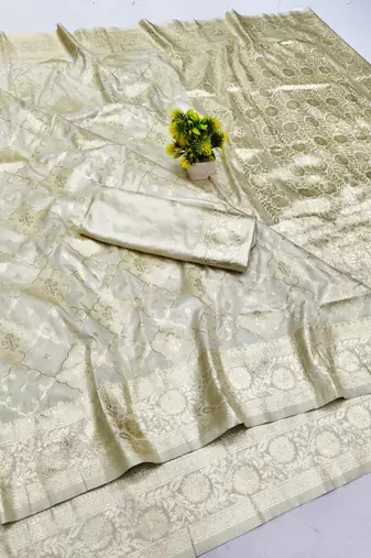 Cream zari woven banarasi silk blend saree with blouse piece