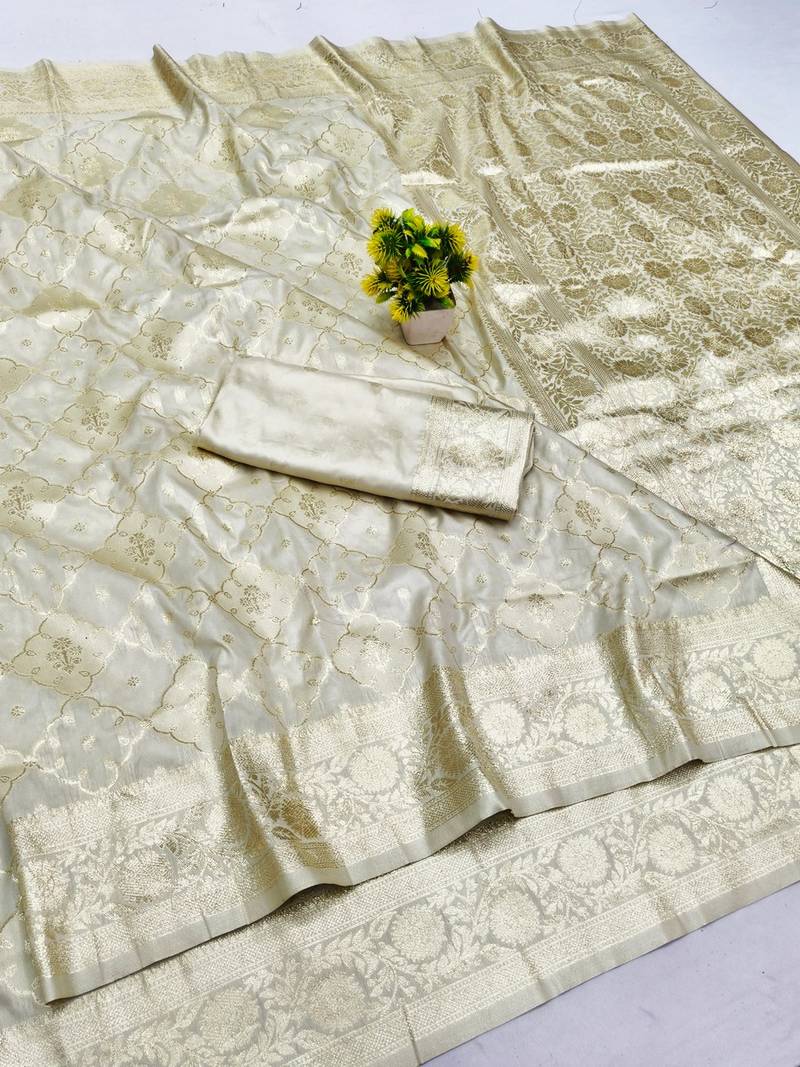 Cream zari woven banarasi silk blend saree with blouse piece