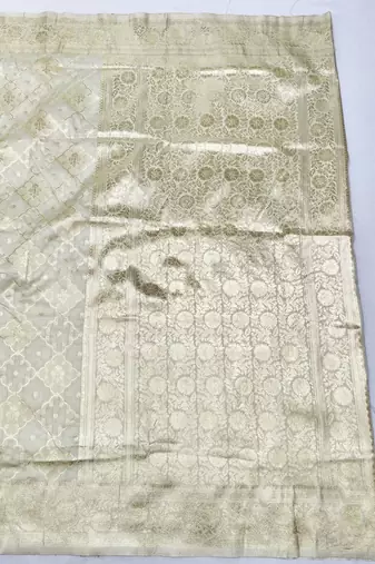 Cream zari woven silk blend saree with blouse piece