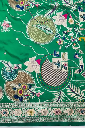Green zari woven silk blend saree with blouse piece