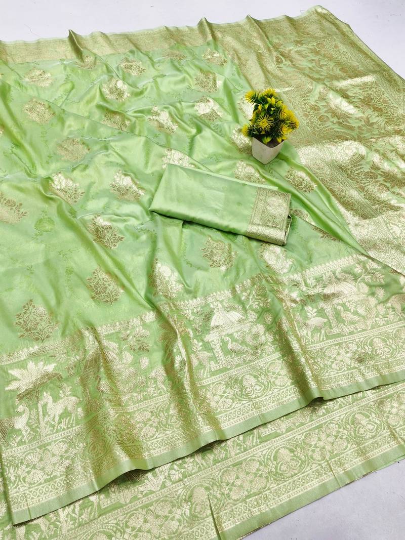 Light green zari woven banarasi silk blend saree with blouse piece