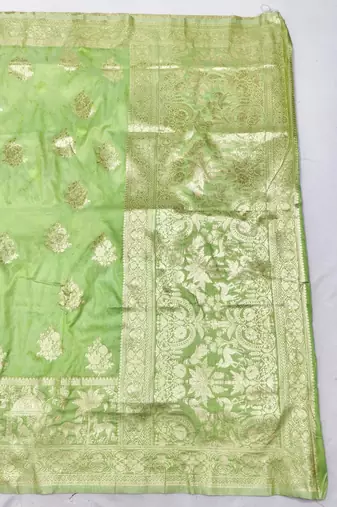 Light green zari woven silk blend saree with blouse piece