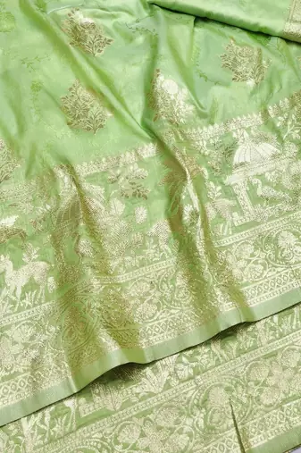 Light green zari woven silk blend saree with blouse piece