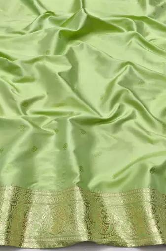 Light green zari woven silk blend saree with blouse piece
