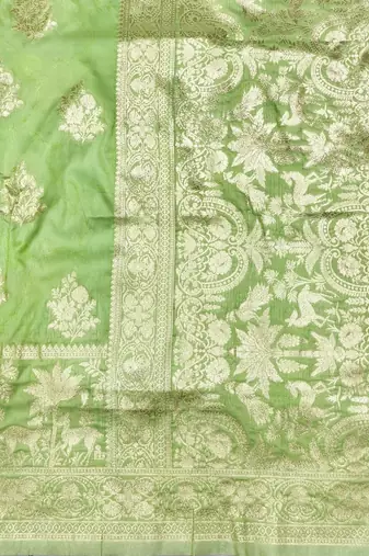 Light green zari woven silk blend saree with blouse piece