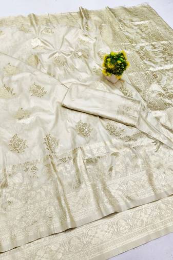 Cream zari woven banarasi silk blend saree with blouse piece