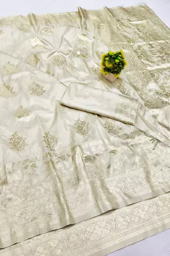 Cream zari woven banarasi silk blend saree with blouse piece