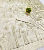 Cream zari woven banarasi silk blend saree with blouse piece