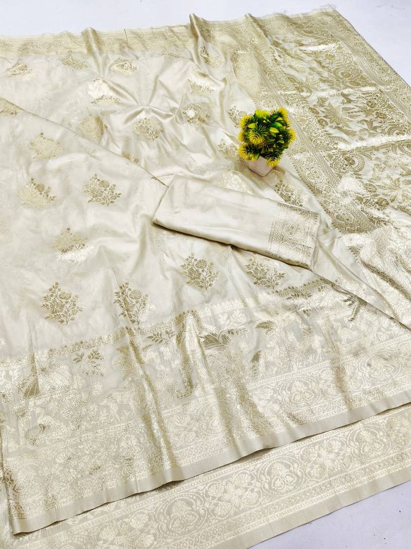 Cream zari woven banarasi silk blend saree with blouse piece