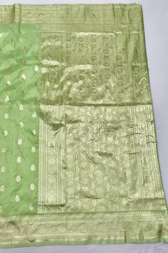 Light green zari woven silk blend saree with blouse piece