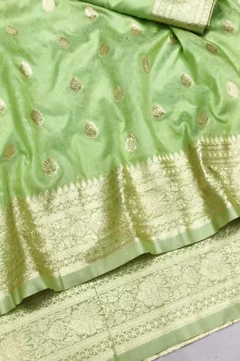 Light green zari woven silk blend saree with blouse piece