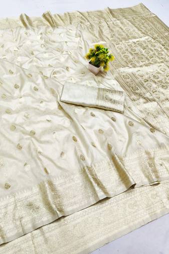 Cream zari woven banarasi silk blend saree with blouse piece