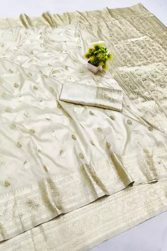 Cream zari woven banarasi silk blend saree with blouse piece
