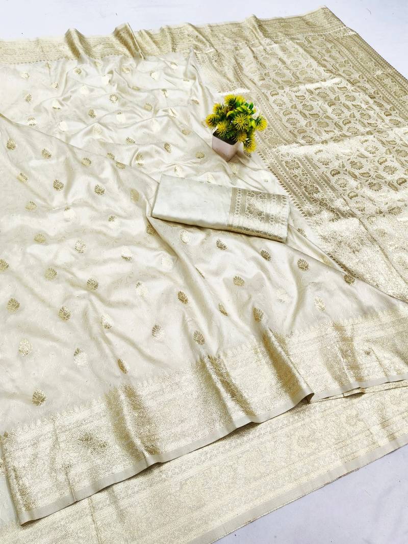 Cream zari woven banarasi silk blend saree with blouse piece