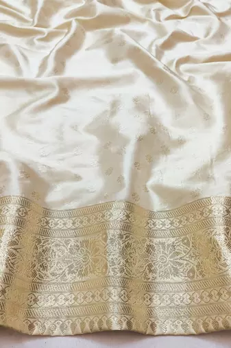 Cream zari woven silk blend saree with blouse piece