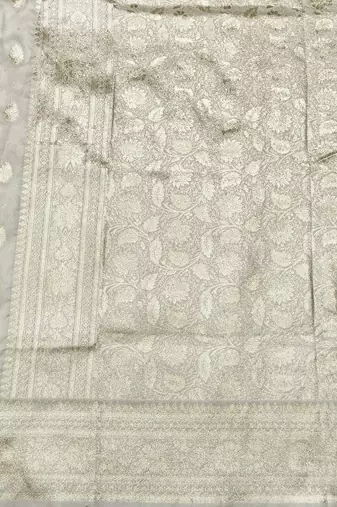 Cream zari woven silk blend saree with blouse piece