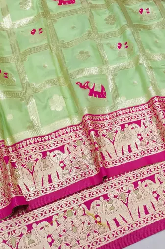 Light green zari woven silk blend saree with blouse piece