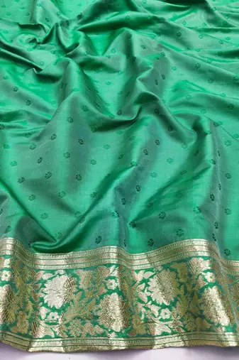 Green zari woven silk blend saree with blouse piece