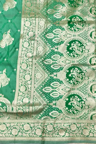 Green zari woven silk blend saree with blouse piece