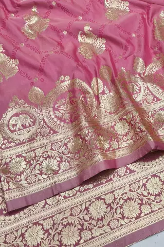 Pink zari woven silk blend saree with blouse piece