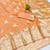 Orange zari woven banarasi silk blend saree with blouse piece