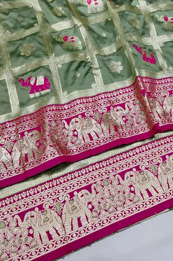 Pista green zari woven silk blend saree with blouse piece