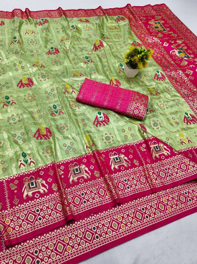 Light green zari woven patola silk blend saree with blouse piece