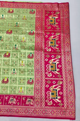 Light green zari woven patola silk blend saree with blouse piece