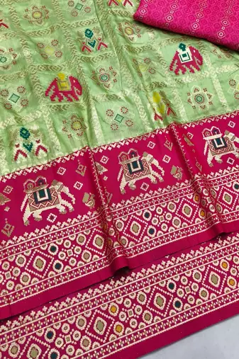 Light green zari woven patola silk blend saree with blouse piece