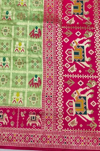Light green zari woven patola silk blend saree with blouse piece