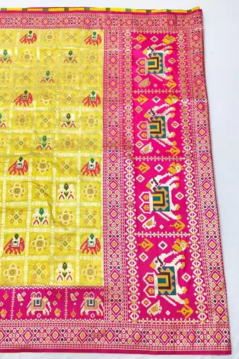 Gold zari woven patola silk blend saree with blouse piece