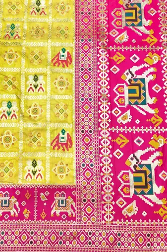 Gold zari woven patola silk blend saree with blouse piece