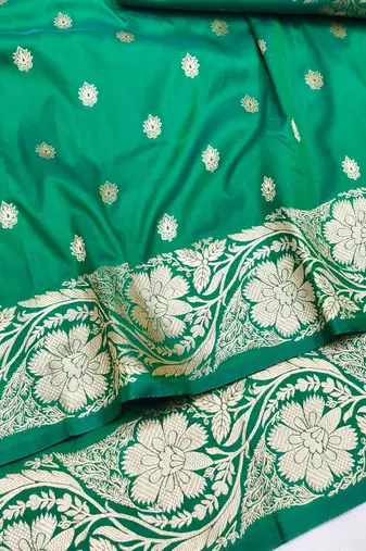 Green zari woven silk blend saree with blouse piece