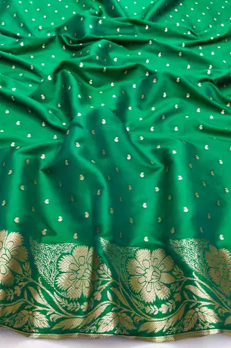 Green zari woven silk blend saree with blouse piece