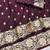 Wine zari woven banarasi silk blend saree with blouse piece