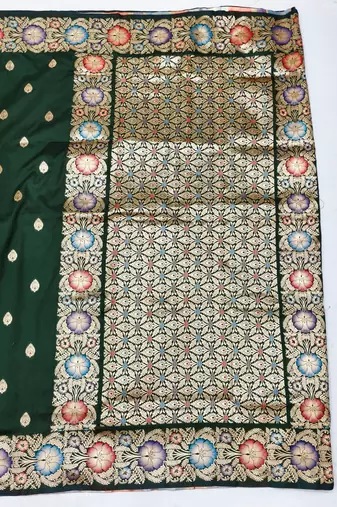 Dark green zari woven silk blend saree with blouse piece
