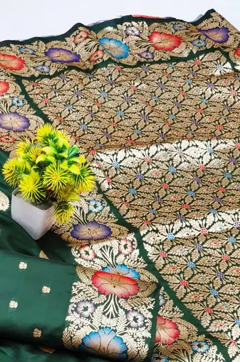 Dark green zari woven silk blend saree with blouse piece