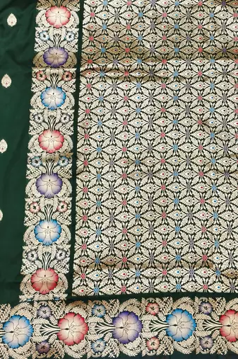 Dark green zari woven silk blend saree with blouse piece
