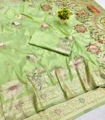 Light green zari woven banarasi silk blend saree with blouse piece