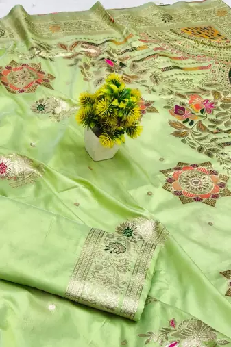 Light green zari woven silk blend saree with blouse piece
