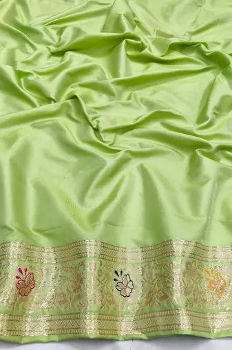 Light green zari woven silk blend saree with blouse piece